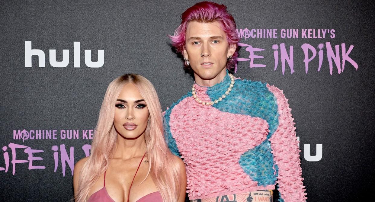 MGK and fiancée Megan Fox debuted matching pink hair colours at the Life In Pink premiere. (Getty Images)