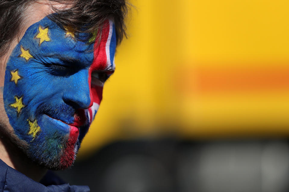 An anti-Brexit protester with face painted in the colors of the European Union (EU) flag and UK national flag. Photo: Krisztian Bocsi/Bloomberg