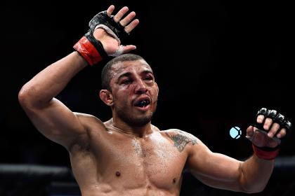 Jose Aldo celebrates after his unanimous-decision victory over Chad Mendes at UFC 179. (Getty)