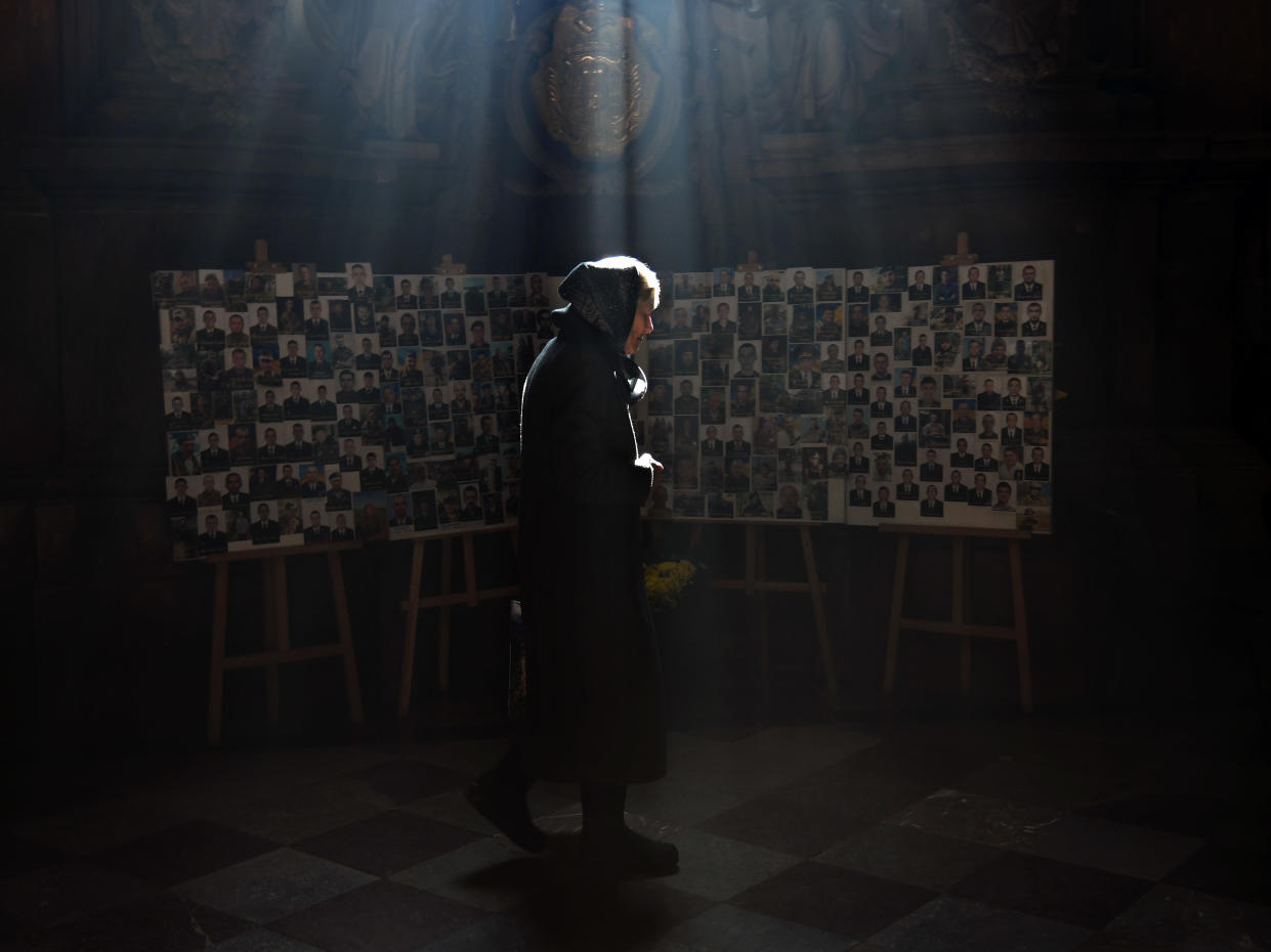 A woman arrives to pray at a church in Lviv, Ukraine.