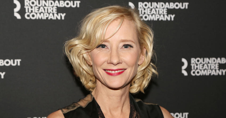 Anne Heche poses on a red carpet