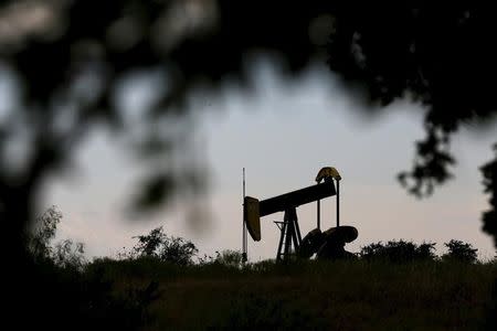 An oil pump jack can be seen in Cisco, Texas, August 23, 2015. REUTERS/Mike Stone