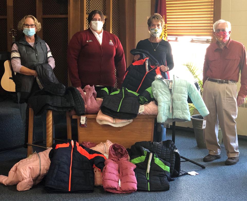 Pictured are members of the Helen Gajdys Reis & Lester Reis Endowment Fund Board donating Coats For Kids to the Salvation Army (from left): Mary Reis, Lt. Jenny Moffitt. Gloria Theis and Howard Zimmerman.