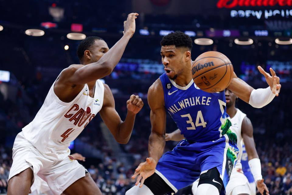 Bucks forward Giannis Antetokounmpo loses control of the ball while driving to the basket against Cavaliers forward Evan Mobley during the first half Wednesday. Antetokounmpo finished with a game-high 45 points but also had five of the Bucks' 21 turnovers on the night.