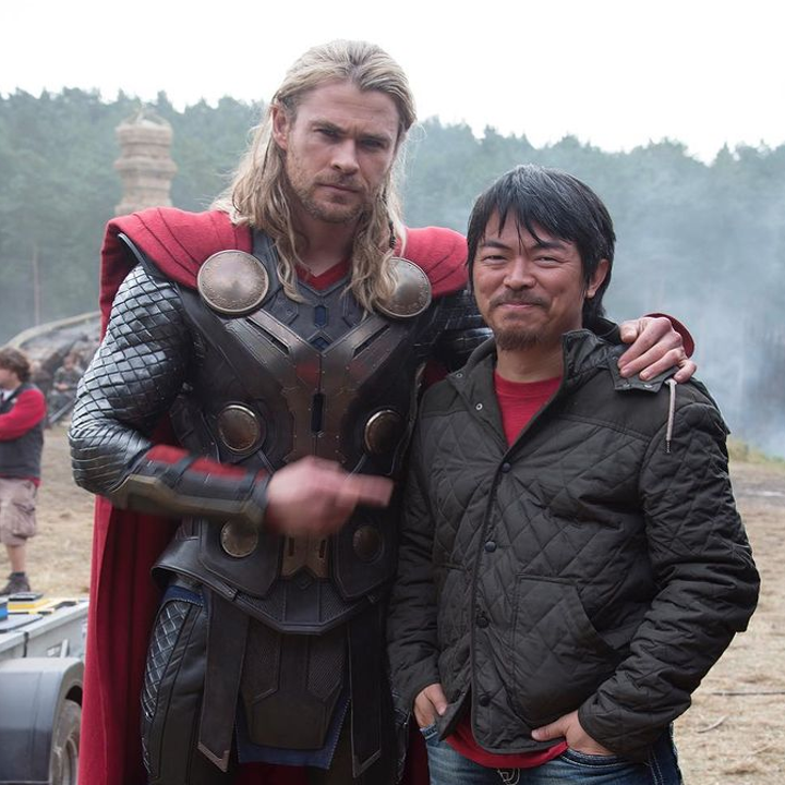 Artist Charlie Wen posing with Chris Hemsworth on the set of Thor