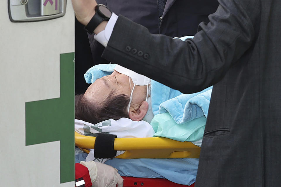 FILE - South Korean opposition leader Lee Jae-myung on a stretcher arrives at a heliport in Seoul, South Korea, Tuesday, Jan. 2, 2024. South Korea police on Wednesday, Jan. 3, raided the residence and office of a man who stabbed the country’s opposition leader, Lee Jae-myung, in the neck earlier this week in an attack that left him hospitalized in an intensive care unit, officials said. (Im Hwa-young/Yonhap via AP, File)