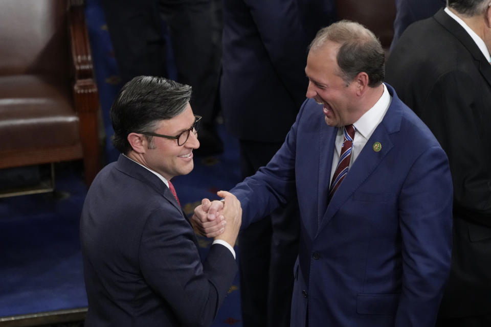 FILE - Rep. Mike Johnson, R-La., left., is congratulated by Rep. Andy Barr, R-Ky., at the Capitol in Washington, Oct. 25, 2023. As Johnson tries to unite the slim House Republican majority, he's fast running into the same hard-right factions and divisions that his predecessor, Kevin McCarthy was unable to tame. It's disrupting the GOP agenda, shelving priorities and leaving gnawing questions about any leader's ability to govern.(AP Photo/J. Scott Applewhite, File)