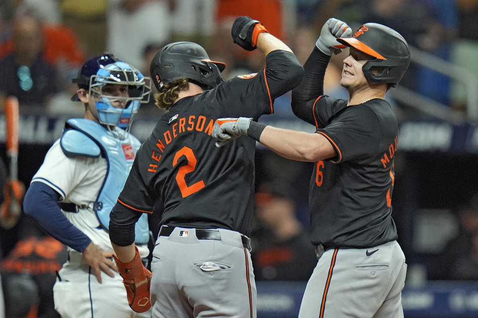 Baltimore Orioles' Ryan Mountcastle, right, celebrates with Gunnar Henderson after Mountcastle hit a two-run home run off Tampa Bay Rays starting pitcher Aaron Civale during the fifth inning of a baseball game Friday, June 7, 2024, in St. Petersburg, Fla. (AP Photo/Chris O'Meara)