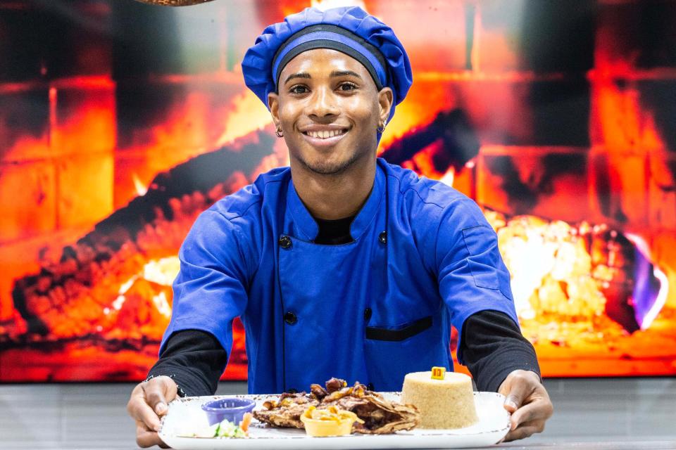 Chef Ahmed Lumeh serves a dish at Catch 45, a recently opened resturant offering African and Western cuisine in Newark, Wednesday, Sept. 27, 2023.