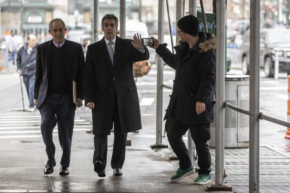 Michael Cohen, second left, arrives at the district attorney's office to testify before a grand jury in New York, Monday, March 13, 2023. (AP Photo/Yuki Iwamura)