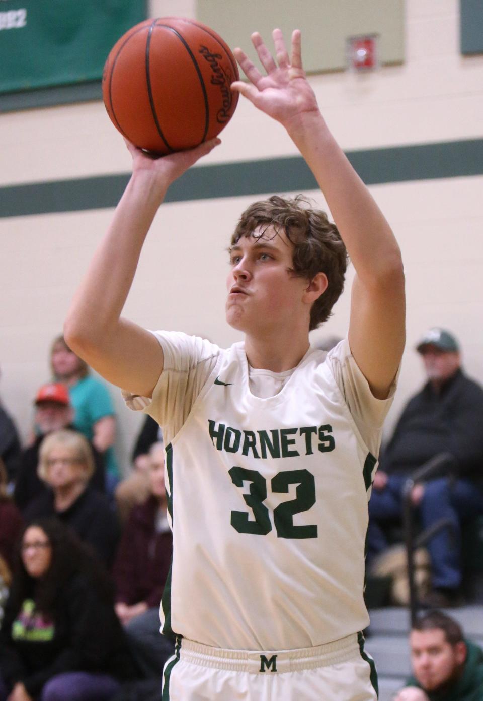 Mitchell Minor of Malvern takes  a deep shot during their game against East Canton at Malvern on Friday, Jan. 28, 2022.