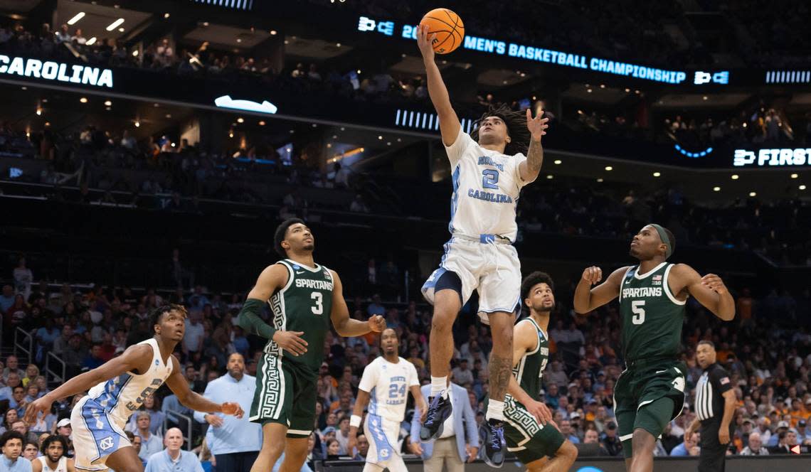 North Carolina’s Elliot Cadeau (2) breaks to the basket through the Michigan State defense during the second half on Saturday, March 23, 2024, in the second round of the NCAA Tournament at Spectrum Center in Charlotte, N.C. Cadeau scored six points in the victory.