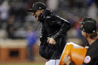 New York Mets starting pitcher Tylor Megill reacts after having water dumped on him after the team's baseball game against the Philadelphia Phillies on Friday, April 29, 2022, in New York. The Mets won 3-0 on a combined no-hitter. (AP Photo/Adam Hunger)