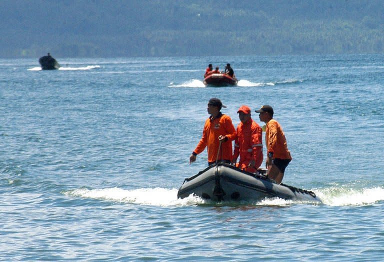 This file photo shows coastguard rescue team searching for survivors after an accident off southern island of Mindanao, on August 26, 2008. Fishermen and rescue workers hauled dozens of people out of the ocean after a ferry sank in the central Philippines on Friday, but at least two passengers drowned and 13 others were missing, authorities said