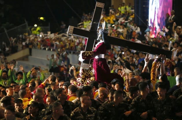 The Black Nazarene, an ebony statue of Jesus that’s believed to have miraculous powers, is carried through the streets of Manila, Philippines, on January 9, 2017. See more photos of the 22-hour procession <a href="https://www.theatlantic.com/photo/2017/01/the-procession-of-the-black-nazarene/512693/" rel="nofollow noopener" target="_blank" data-ylk="slk:here;elm:context_link;itc:0;sec:content-canvas" class="link ">here</a>. (Bullit Marquez / Reuters)