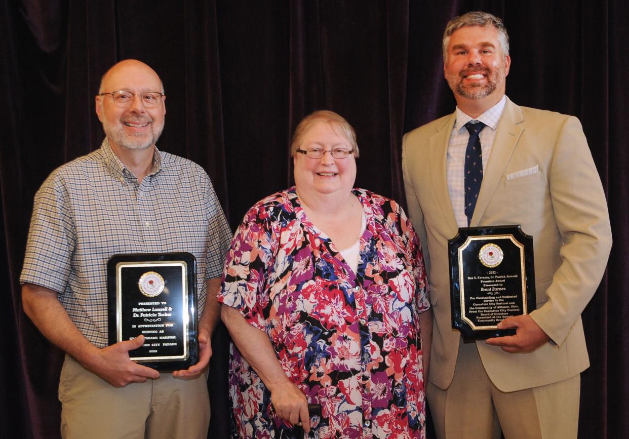 The 2022 Greater Alliance Carnation Festival Community Luncheon on Saturday, Aug. 6, 2022, at Hoover-Price Campus Center at University of Mount Union featured speeches and awards. Pictured here, from left, are Grand Parade Marshal Award winners Matthew Lansell and his wife, Dr. Patricia Tucker, and Brent Barnes, who received the Favazzo-Jeswald Founders Award.