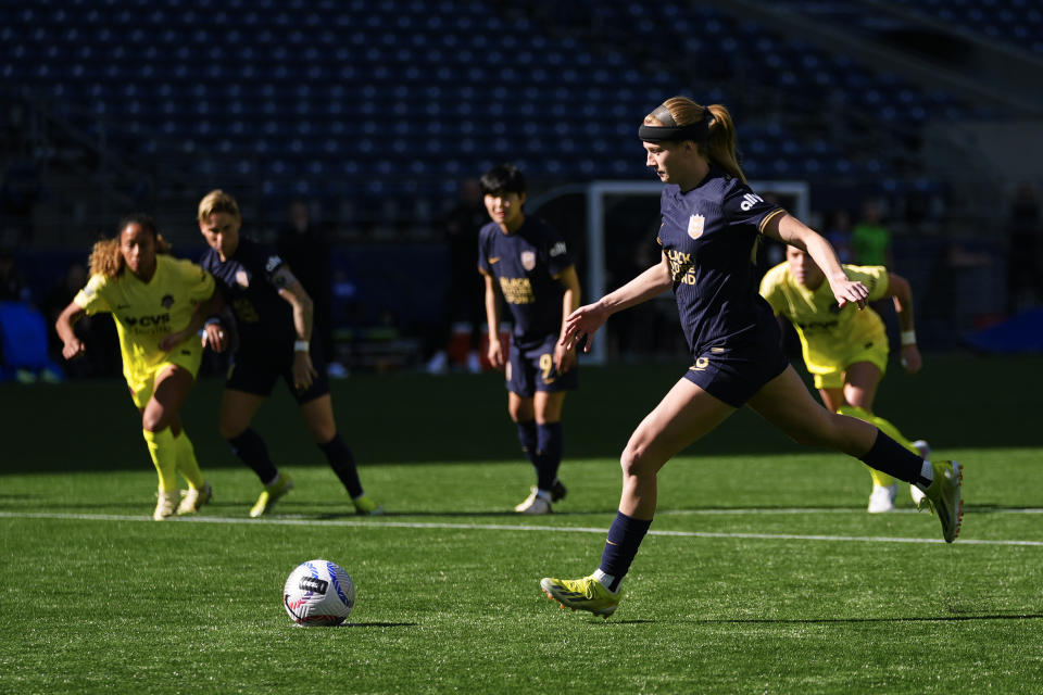 Seattle Reign forward Bethany Balcer scores on a penalty kick during the first half of an NWSL soccer match against the Washington Spirit, Sunday, March 17, 2024, in Seattle. (AP Photo/Lindsey Wasson)