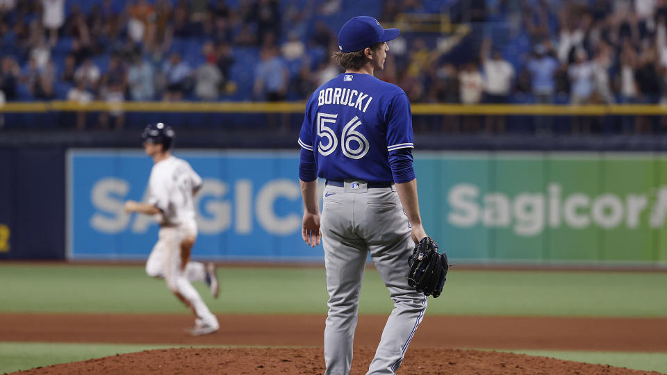 Ryan Borucki (56) looks on as he gives up a home run to Rays third baseman Joey Wendle (18) (USA TODAY Sports)