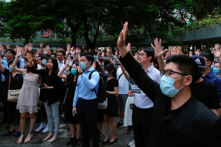 Anti-government demonstrators attend a flash mob protest after violent China's National Day protests, at Central, in Hong Kong