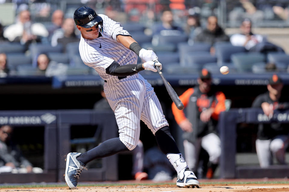 Mar 30, 2023; Bronx, New York, USA; New York Yankees center fielder Aaron Judge (99) hits a solo home run against the San Francisco Giants during the first inning at Yankee Stadium. Mandatory Credit: Brad Penner-USA TODAY Sports
