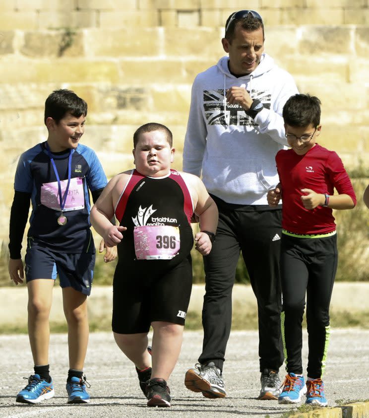 Jake Vella with his coach and friends during a recent race (Picture: Caters)