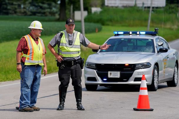 PHOTO: An Ohio State Trooper directs traffic in Wilmington, Ohio, after police closed off Interstate 71 North after reports of a suspect attempting to attack the FBI building in Cincinnati, Aug. 11, 2022. (Jeffrey Dean/Reuters)