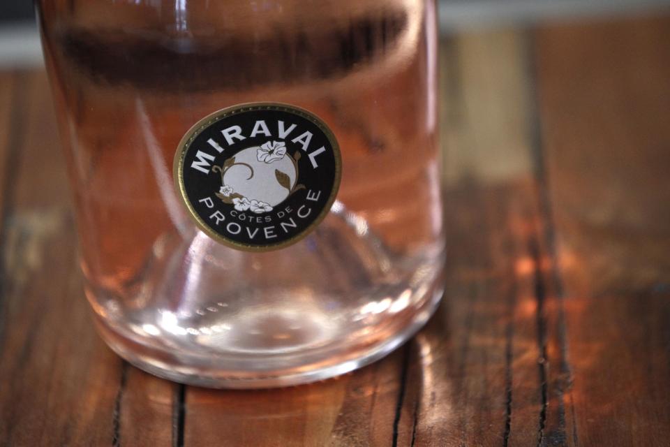 CAPTION CORRECTS NAME OF BOTTLE FROM MIRAMAR TO MIRAVAL A bottle of Miraval 2013 is pictured in Paris, Friday, Jan. 31, 2014. The latest Brad Pitt-Angelina Jolie sequel is being described as powerful and elegant with a “mouthwatering finish.” These raves don’t appear in Hollywood bible Variety _ they’re from Decanter magazine’s review of the celebrity couple’s second vintage of rose wine produced at their Provencal estate Chateau Miraval. The 2013 Miraval goes on sale online Friday and will be in shops and restaurants around the world next month. (AP PhotoThibault Camus)