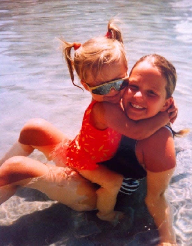 Allie LaForce, right, with her sister, AuBree LaForce, in an old family photo.