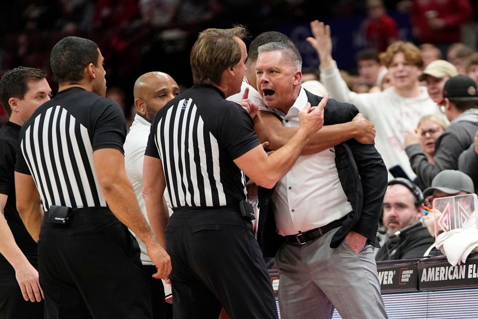 Ohio State coach Chris Holtmann yells at official John Higgins after receiving his second technical and being ejected during Thursday's game against Wisconsin.