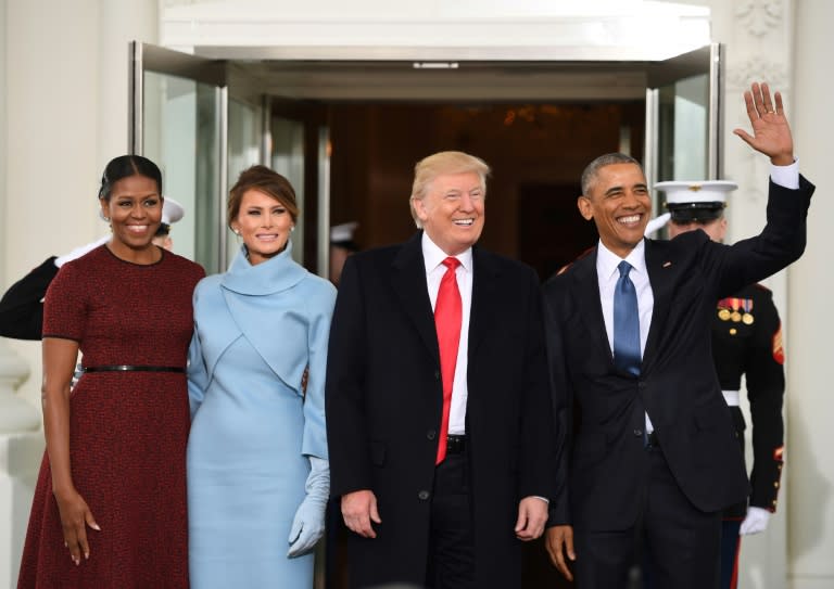 Then-US President Barack Obama (R) and First Lady Michelle Obama (L) welcome then-President-elect Donald Trump (2nd-R) and his wife Melania Trump to the White House in Washington, DC January 20, 2017