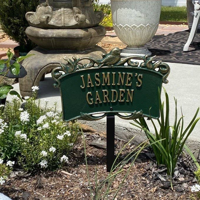A reviewer photo of the personalized garden sign that reads "Jasmine's Garden"