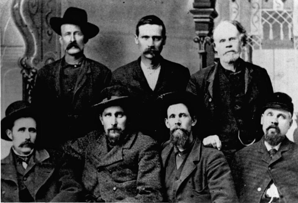 "This photograph of the Boomer leaders was taken in 1884. They are, from left (seated), A. C. McCord, David L. Payne, W. L. Couch, (standing) H. H. Stafford, G. F. Goodrich, and A. P. Lewis. Payne was principal leader of the movement."