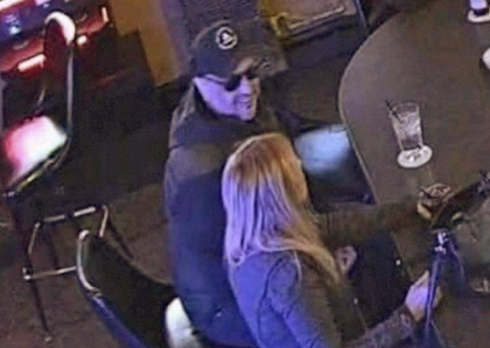 An image from a surveillance video shows a man believed to be Timothy Olson moments before the woman passed out in the bar. (via WTMJ)