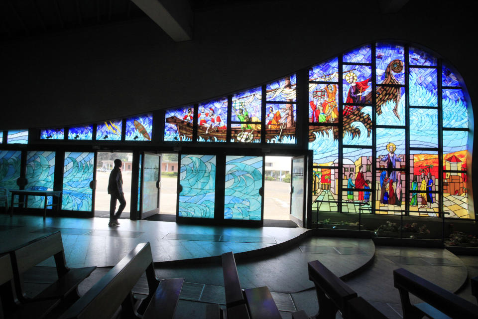 A man walks inside the Cathedral of St. Paul of Abidjan