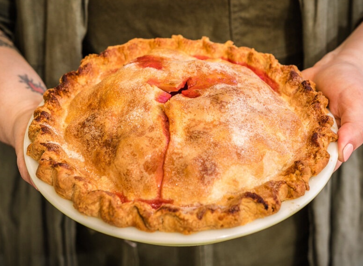 person holding fat and flour pie.