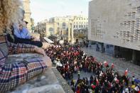 People stage a protest in La Valletta, Malta, Sunday, Dec. 1, 2019. Malta's embattled prime minister has received a pledge of confidence from Labor Party lawmakers amid demands for his resignation by citizens angry over alleged links of his former top aide to the car bomb killing of a Maltese anti-corruption journalist. Hours later, thousands of Maltese protested outside a courthouse demanding that Joseph Muscat step down. (AP Photo)