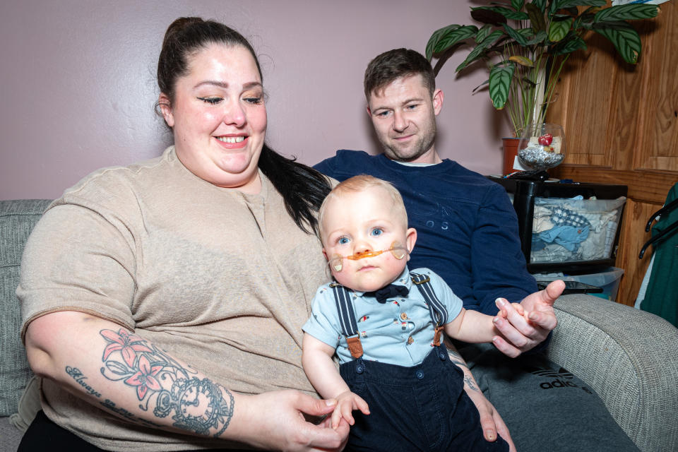 Parents Naomi Walker and Chris Hughes with baby Arley-James Hughes who has just celebrated his first birthday. (National World/SWNS)
