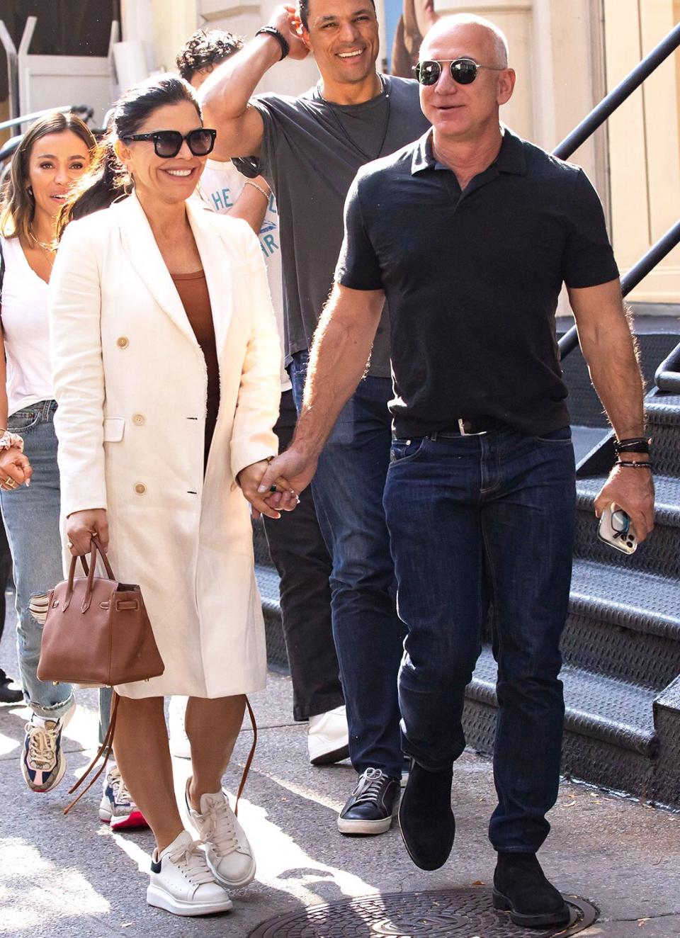 Lauren Sanchez and Jeff Bezos exiting Cipriani's Downtown New York on October 15, 2021.