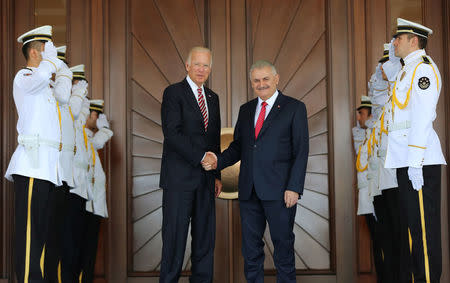 Turkish Prime Minister Binali Yildirim (center R) meets with U.S. Vice President Joe Biden in Ankara, Turkey, August 24, 2016. Mustafa Aktas/Prime Minister's Press Office/Handout via REUTERS