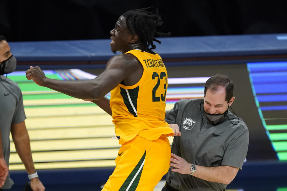 Baylor coach Scott Drew celebrates with Jonathan Tchamwa Tchatchoua following the team's NCAA college basketball game against Illinois, early Thursday, Dec. 3, 2020, in Indianapolis. Baylor won 82-69. (AP Photo/Darron Cummings)