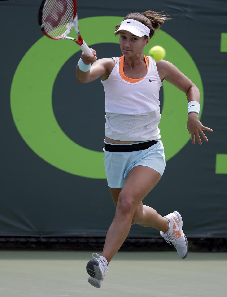 Lauren Davis, of the United States, returns the ball to Ana Ivanovic, of Serbia, during a match at the Sony Open tennis tournament, Thursday, March 20, 2014, in Key Biscayne, Fla. AP Photo/Lynne Sladky)