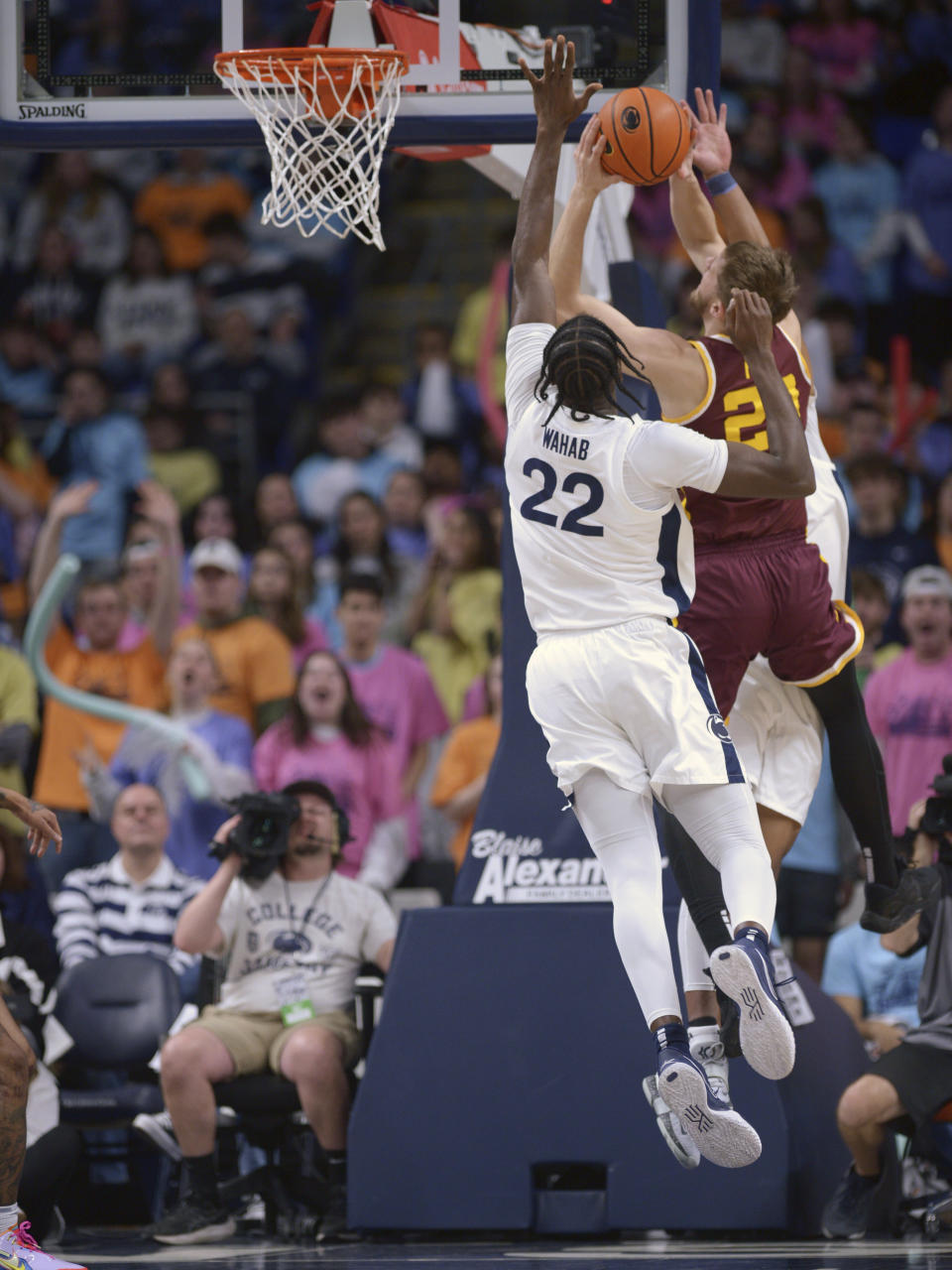 Minnesota's Parker Fox, right, drives to the basket on Penn State's Qudus Wahab (22) during the first half of an NCAA college basketball game Saturday, Jan. 27, 2024, in State College, Pa. (AP Photo/Gary M. Baranec)