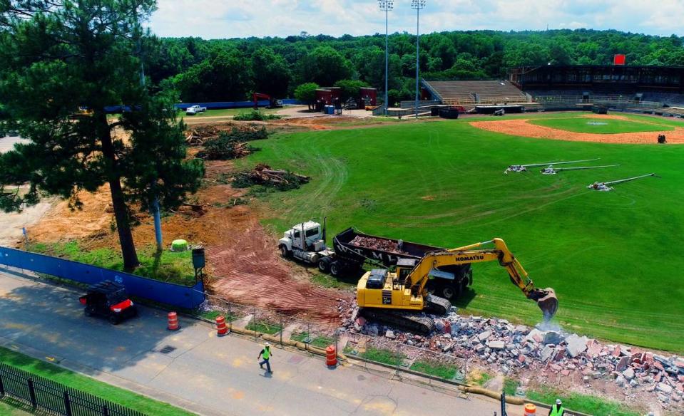 One pine tree was left due to workers fearing they may hit the stadium light when removing the tree. Workers took down trees and demolished the outfield wall Tuesday at Golden Park in Columbus, Georgia. 05/07/2024 Mike Haskey/mhaskey@ledger-enquirer.com
