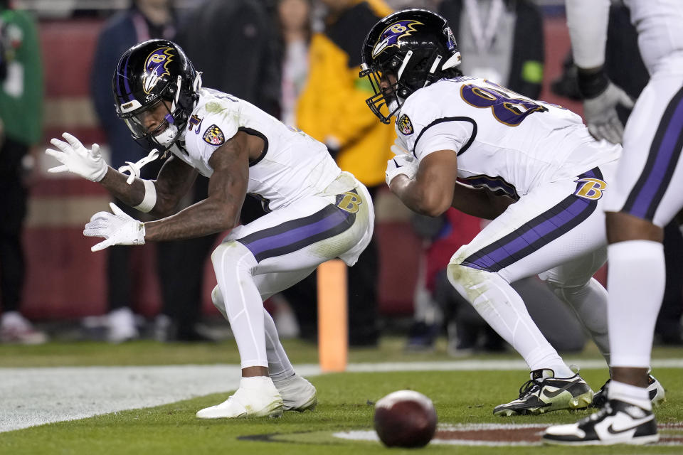 Baltimore Ravens wide receiver Zay Flowers, left, celebrates with tight end Isaiah Likely after scoring against the San Francisco 49ers during the second half of an NFL football game in Santa Clara, Calif., Monday, Dec. 25, 2023. (AP Photo/Godofredo A. Vásquez)