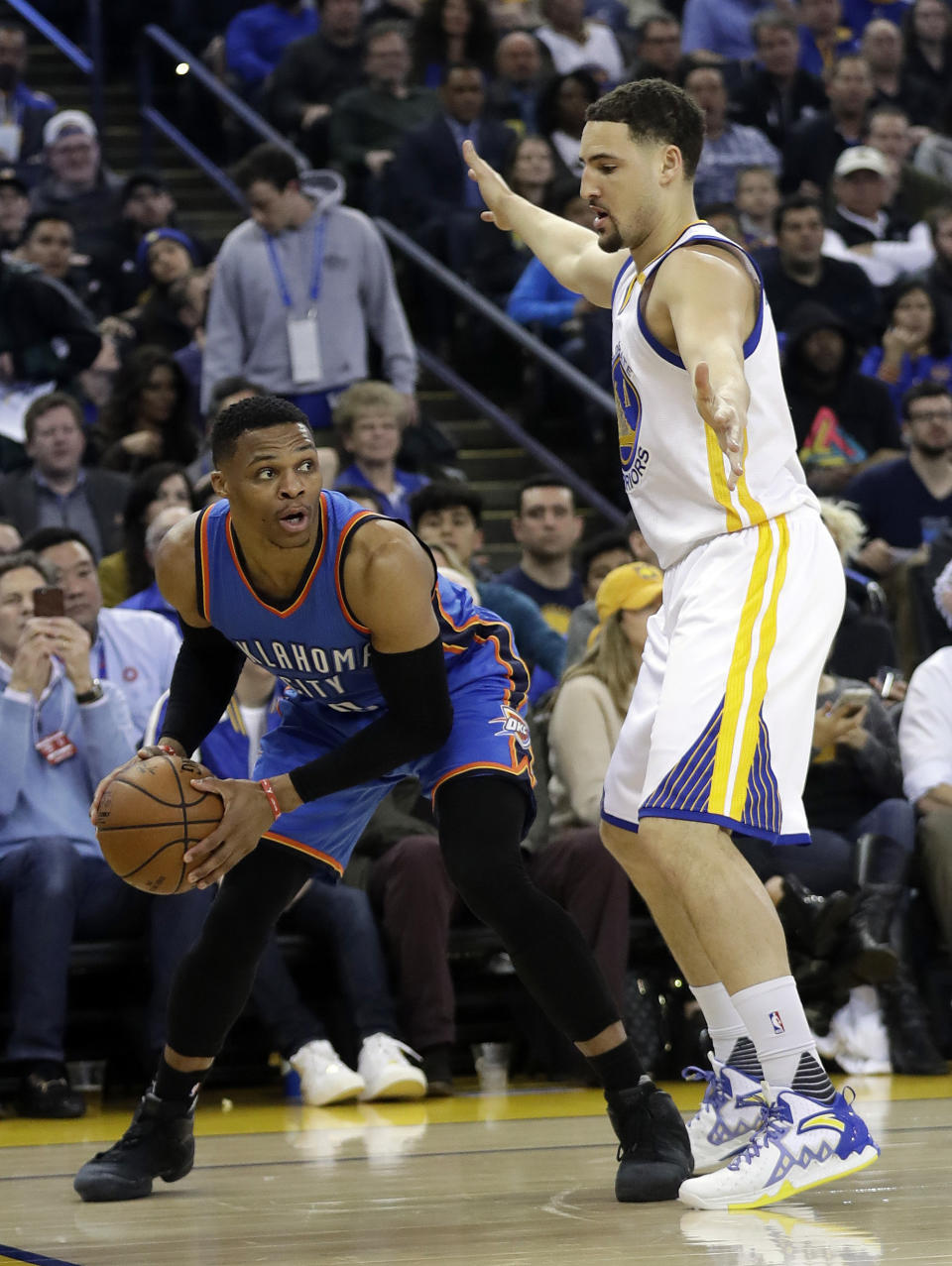 Oklahoma City Thunder's Russell Westbrook, left, is defended by Golden State Warriors' Klay Thompson during the first half of an NBA basketball game Wednesday, Jan. 18, 2017, in Oakland, Calif. (AP Photo/Marcio Jose Sanchez)