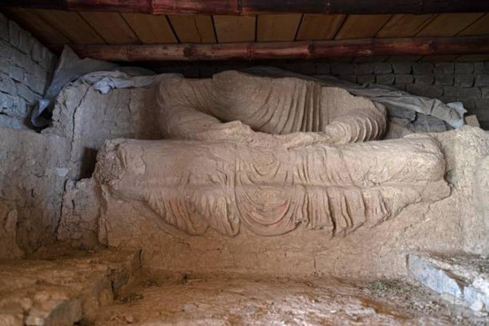 This picture taken on May 17, 2022, shows a part of a statue of Buddha after being uncovered at an archaeological site in Mes Aynak, in the eastern province of Logar (AFP via Getty Images)