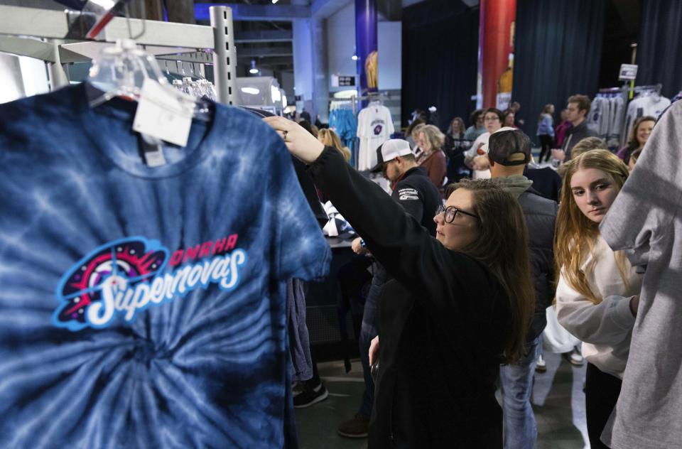 Johanna Shinn shops for Omaha Supernovas merchandise before a game against the Atlanta Vibe during a Pro Volleyball Federation game Wednesday, Jan. 24, 2024, in Omaha, Neb. (AP Photo/Rebecca S. Gratz)