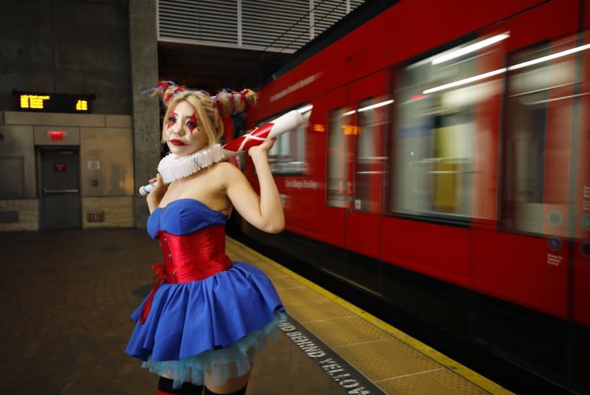 Tita Ghanjanasak dressed as Harley Quinn Batman: The Dark Prince Charming at the San Diego State University Transit Station. Ghanjanasak has been going to Comic-Con for four years and her favorite thing see is the Game of Thrones cosplay.