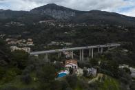 Sixth-generation lemon farmer Pierre Ciabaud's house and lemon farm sits near the highway in Menton, France, Wednesday, March 6, 2024. “The valleys of Menton used to be covered with lemon groves, there were trees everywhere,” Ciabaud said. (AP Photo/Daniel Cole)