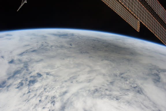 This is one of a series of photos taken by Expedition 31 Flight Engineer Don Pettit aboard the International Space Station, showing a shadow of the moon created by the May 20, 2012 solar eclipse, as the shadow spreads across cloud cover on Eart